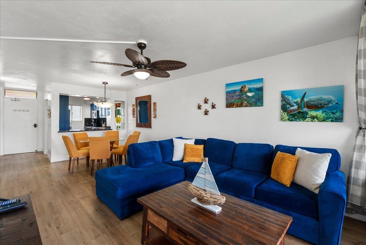 760 South Kihei Road, Unit 405 Kihei, HI 96753 - Photo 2 of 39 a living room with furniture kitchen view and a chandelier