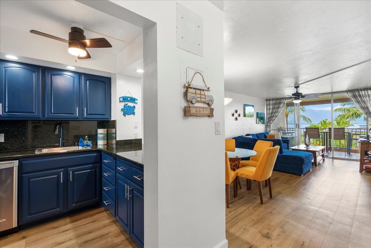 760 South Kihei Road, Unit 405 Kihei, HI 96753 - Photo 24 of 39 a open kitchen with stainless steel appliances granite countertop a stove and a refrigerator