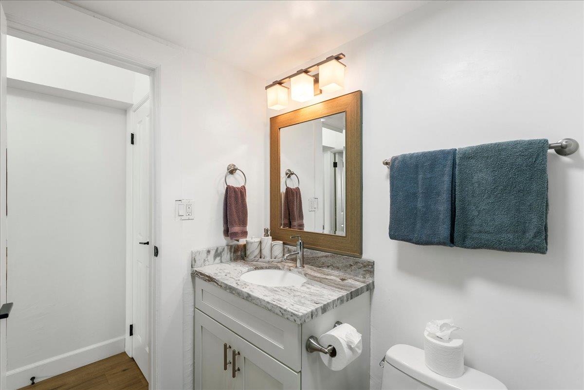 760 South Kihei Road, Unit 405 Kihei, HI 96753 - Photo 30 of 39 a bathroom with a granite countertop sink and a mirror