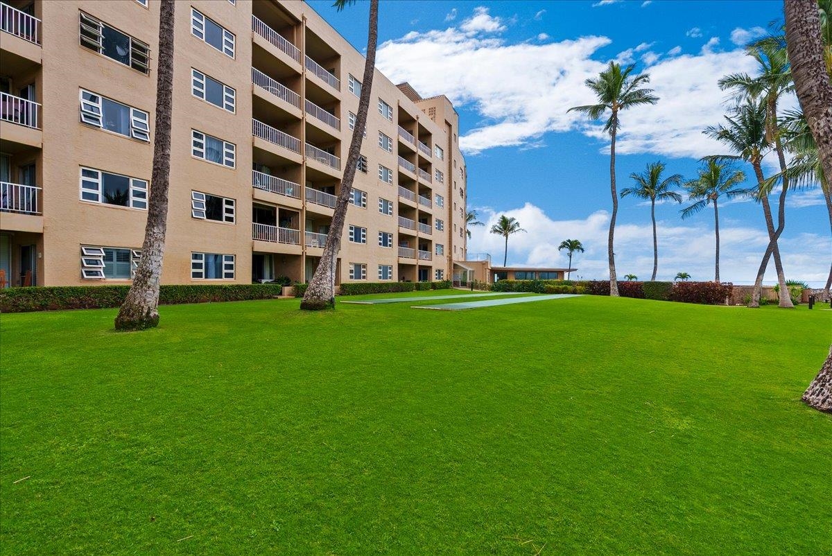 760 South Kihei Road, Unit 405 Kihei, HI 96753 - Photo 36 of 39 a large building with a yard