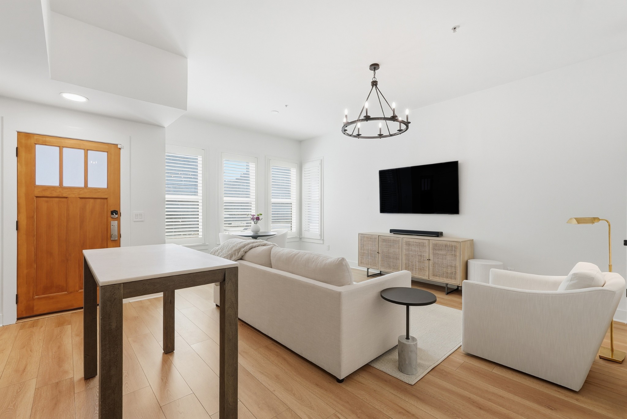 520 Madison Street Nashville, TN 37208 - Photo 1 of 16 a living room with furniture a flat screen tv and a window