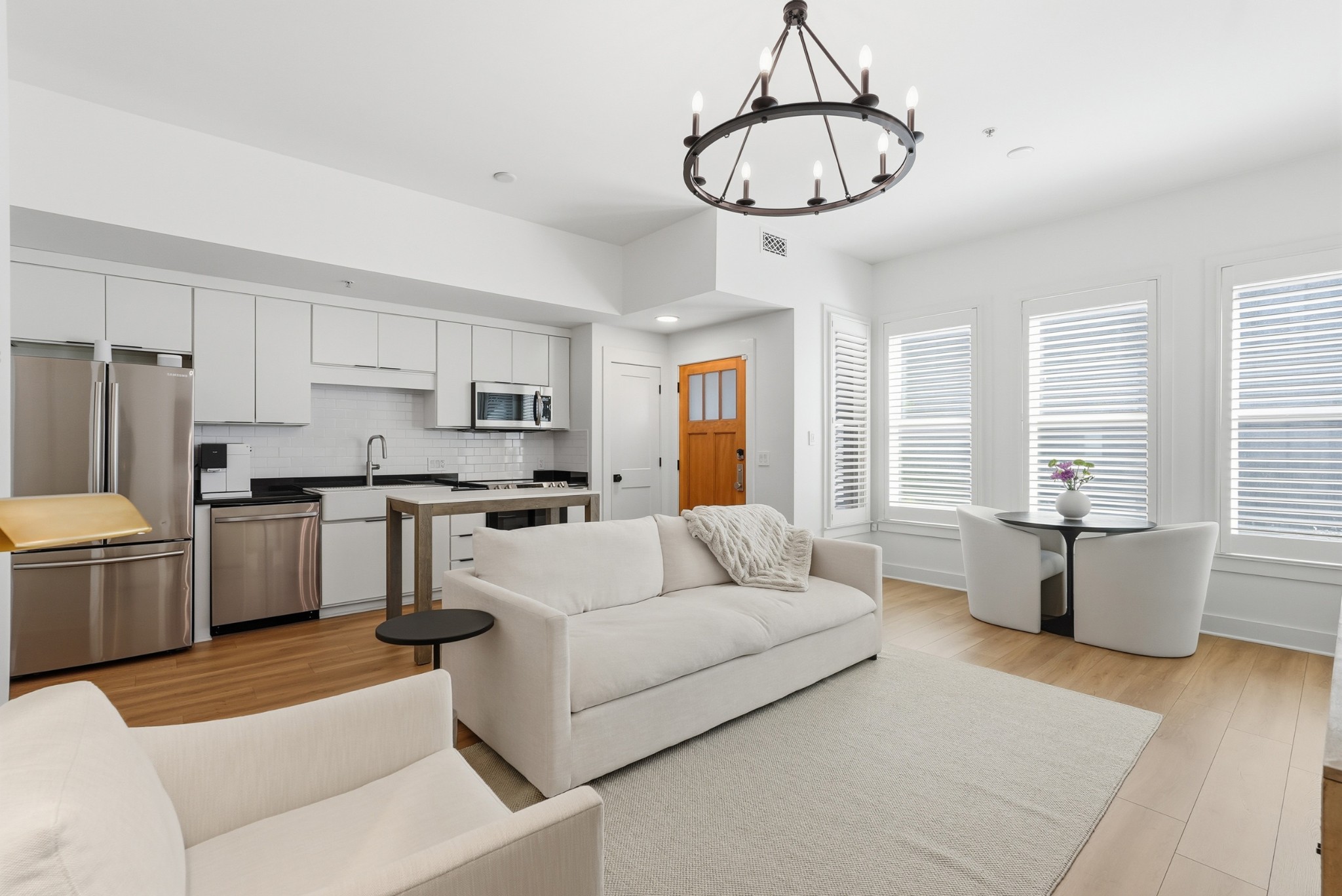 520 Madison Street Nashville, TN 37208 - Photo 4 of 16 a living room with furniture and kitchen view
