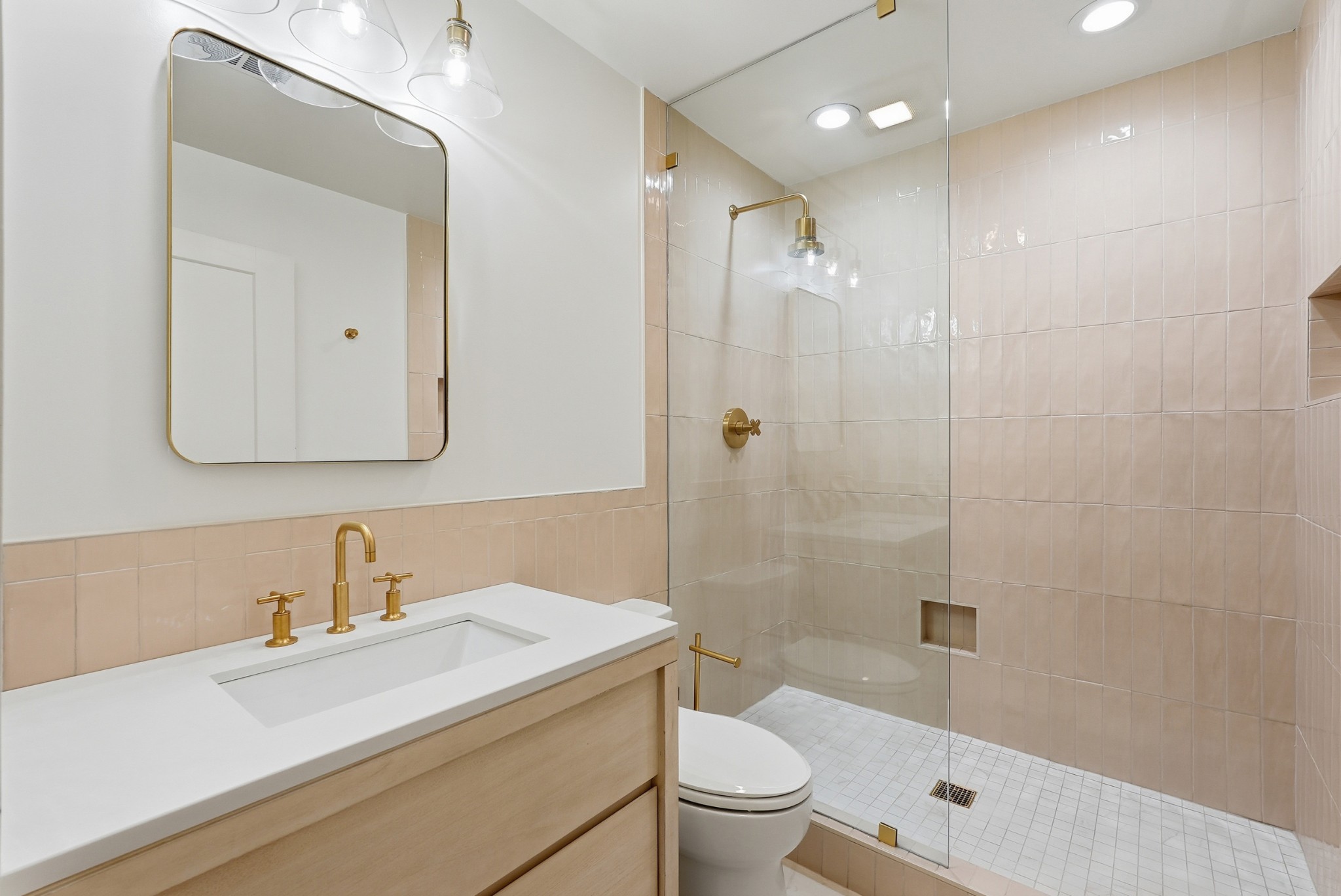520 Madison Street Nashville, TN 37208 - Photo 9 of 16 a bathroom with a sink a toilet and shower