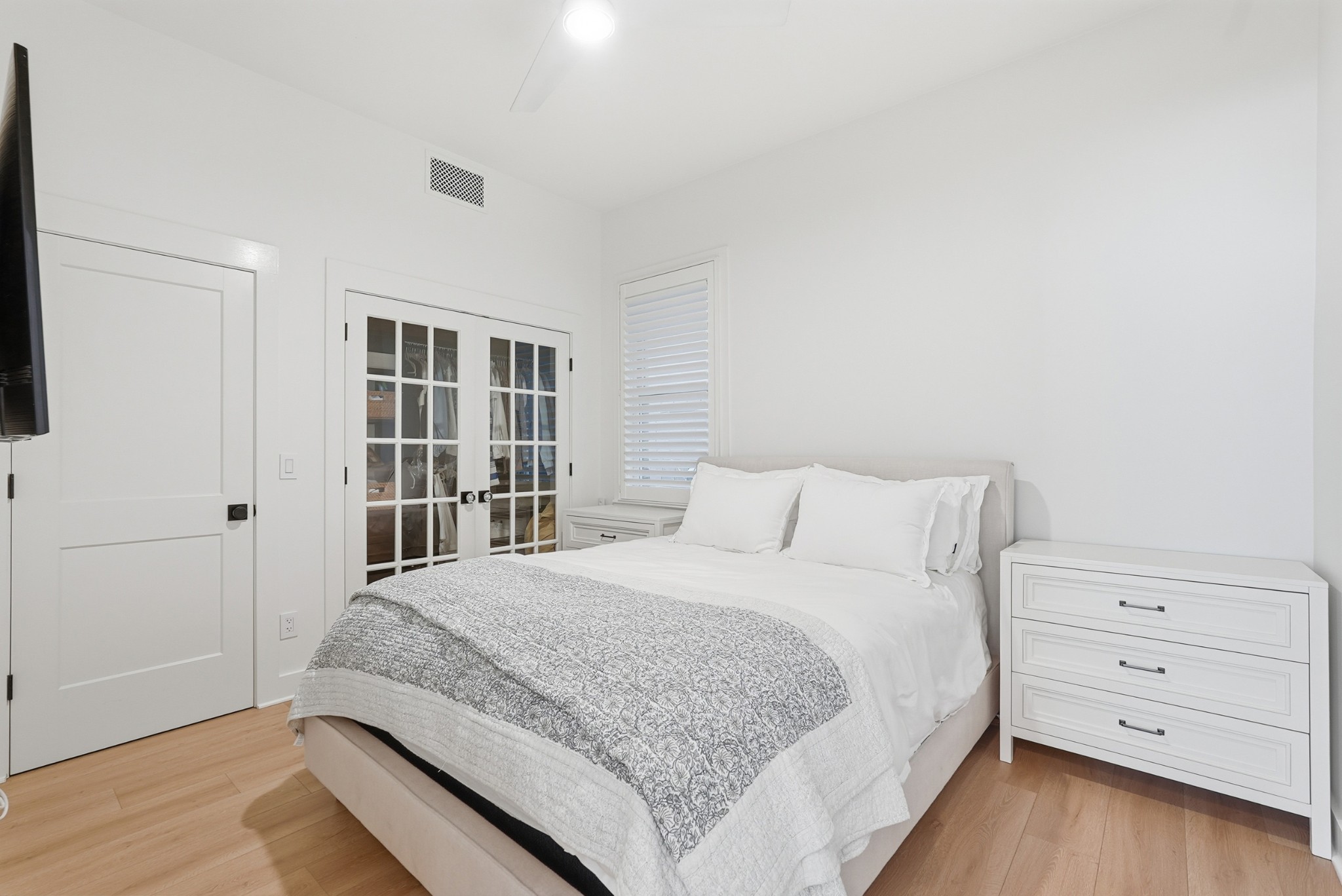 520 Madison Street Nashville, TN 37208 - Photo 10 of 16 a bedroom with a bed and a window