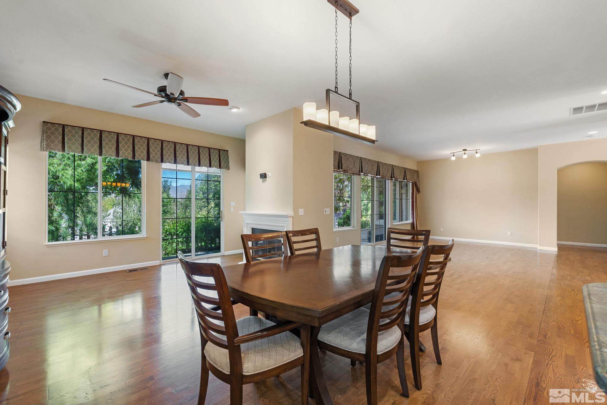 1745 Hunter Creek Road Reno, NV 89519 - Photo 20 of 40 a view of a dining room with furniture window and wooden floor