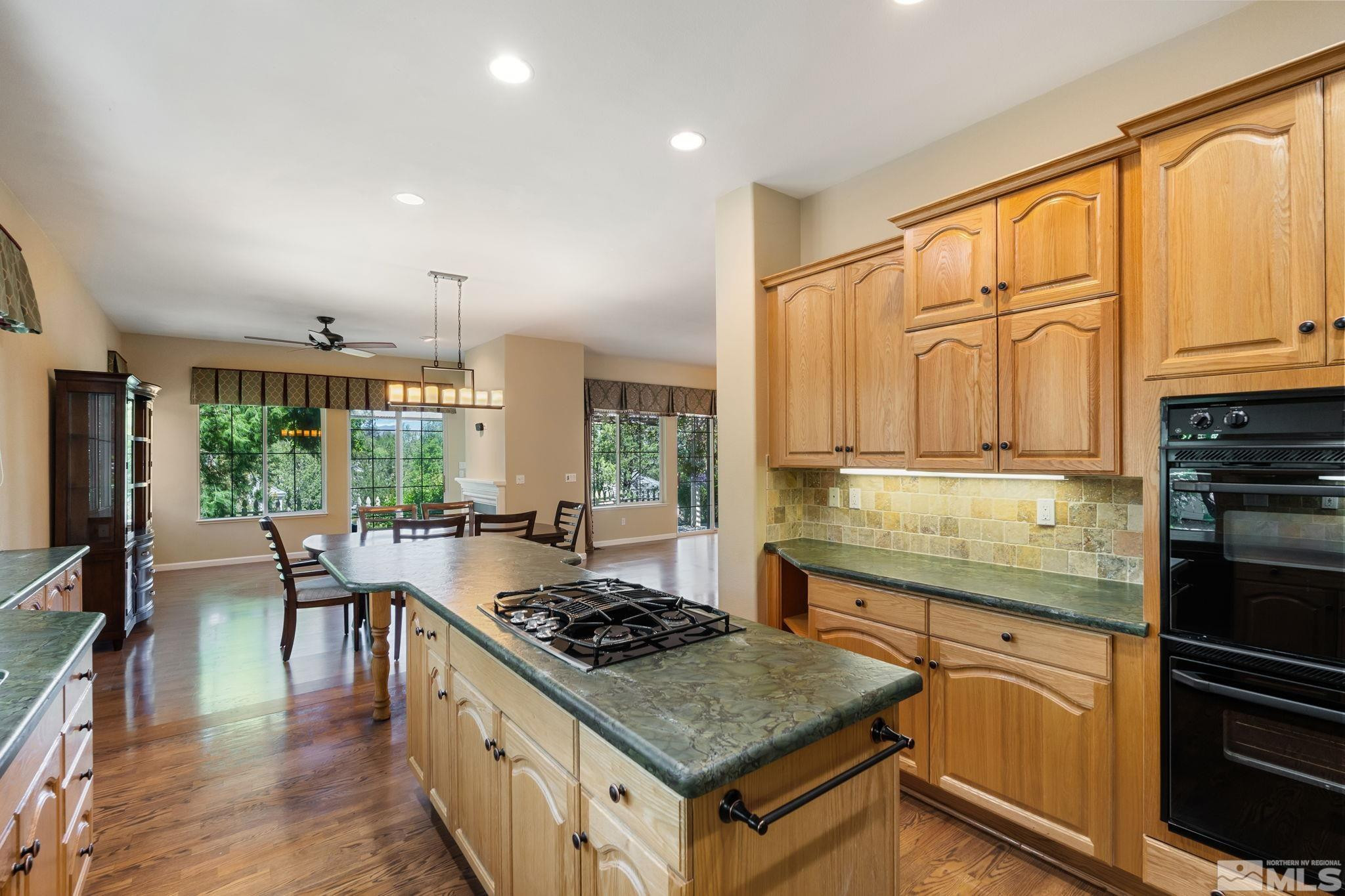 1745 Hunter Creek Road Reno, NV 89519 - Photo 23 of 40 a kitchen with a stove a sink and a refrigerator