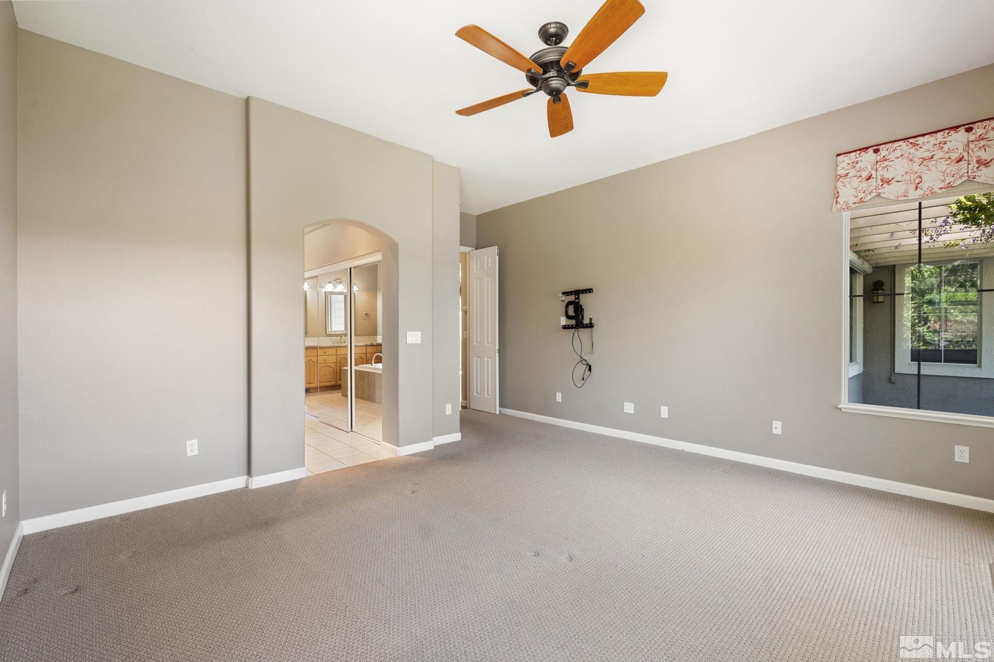 1745 Hunter Creek Road Reno, NV 89519 - Photo 28 of 40 a view of a livingroom with a ceiling fan and window