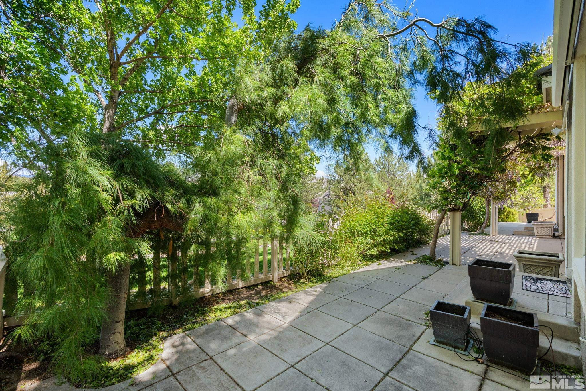 1745 Hunter Creek Road Reno, NV 89519 - Photo 39 of 40 a view of a backyard with chairs and a potted plant