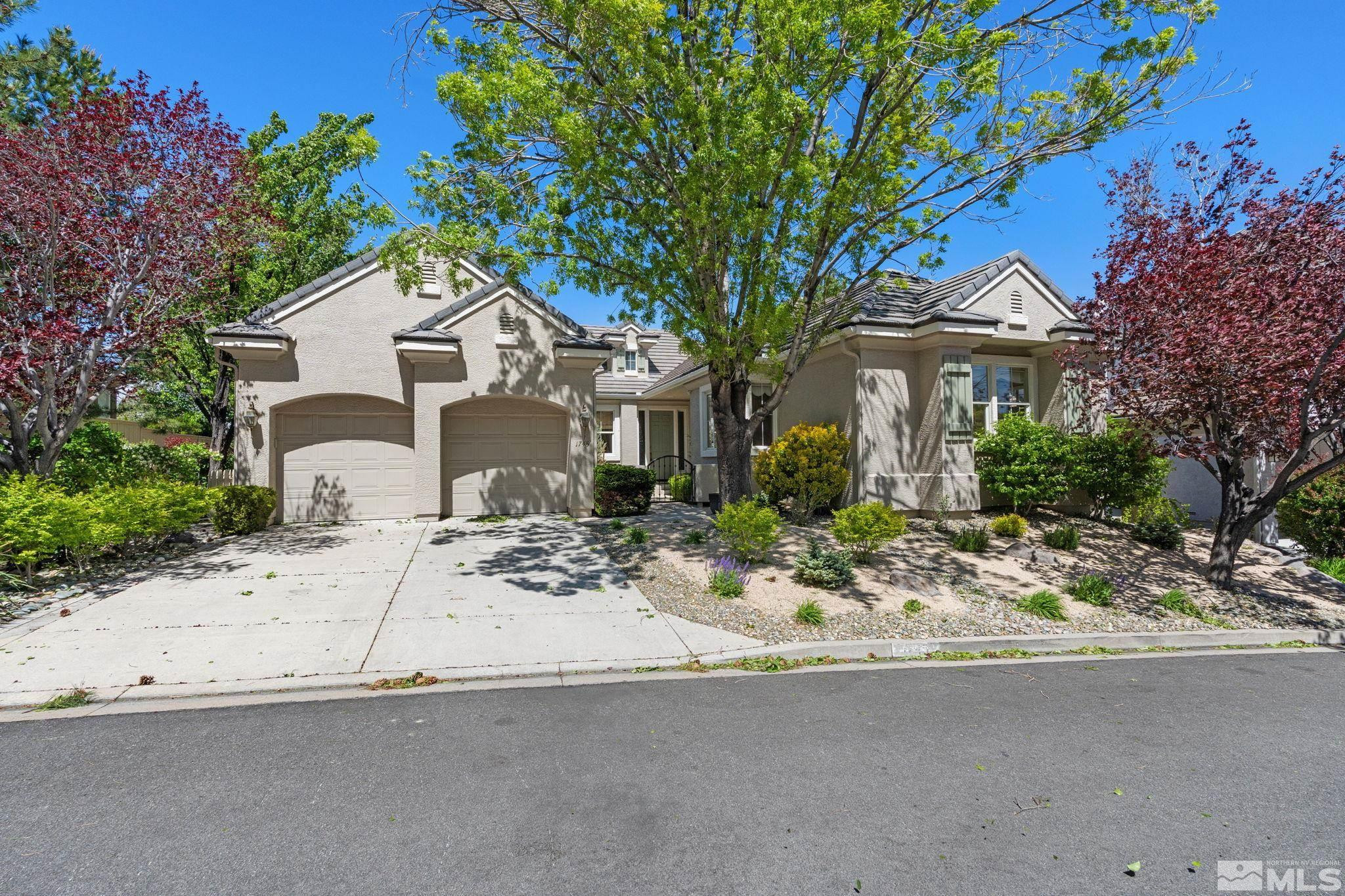 1745 Hunter Creek Road Reno, NV 89519 - Photo 7 of 40 a front view of a house with a tree