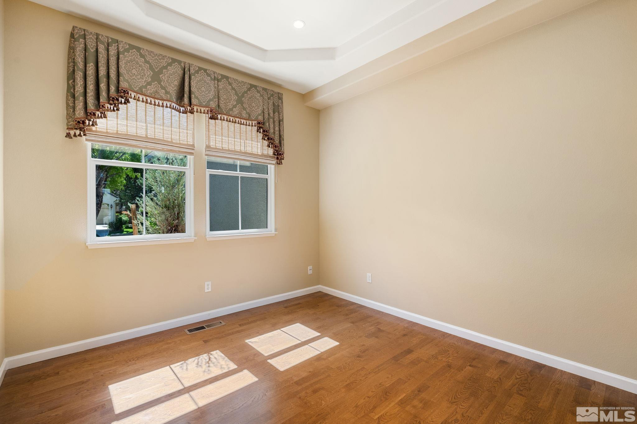 1745 Hunter Creek Road Reno, NV 89519 - Photo 9 of 40 an empty room with a window