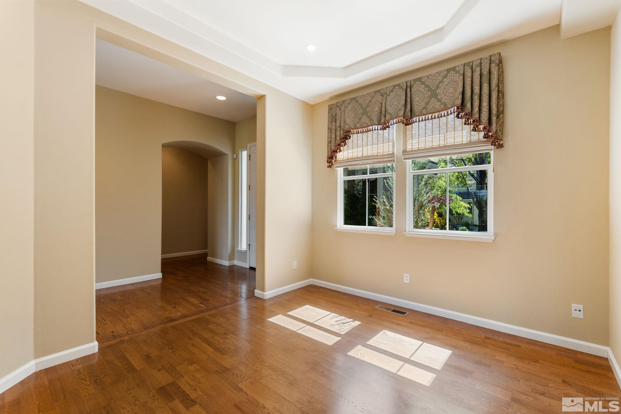 1745 Hunter Creek Road Reno, NV 89519 - Photo 10 of 40 a view of an empty room with glass door and windows