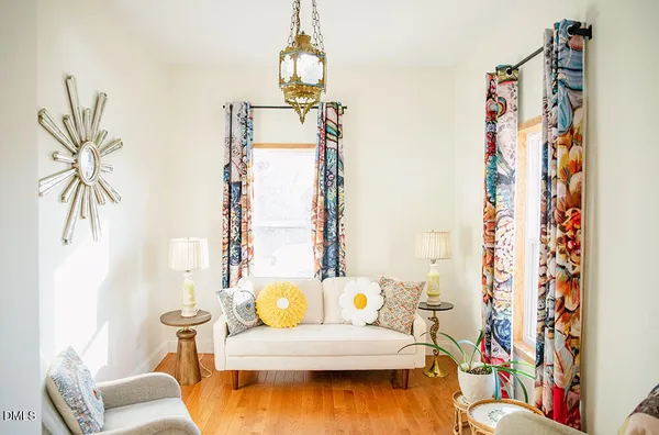 a living room with furniture and a rug