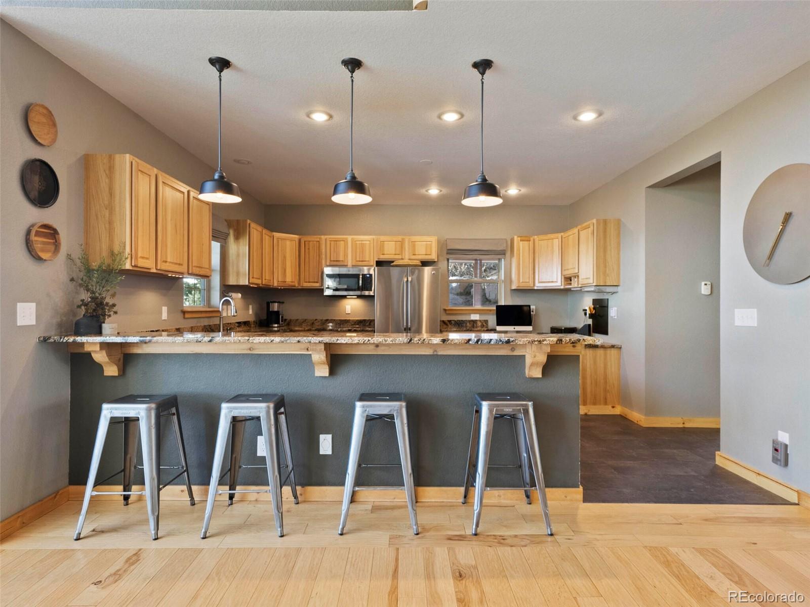 8335 Doubleheader Ranch Road Morrison, CO 80465 - Photo 12 of 40 a large kitchen with lots of counter space and appliances