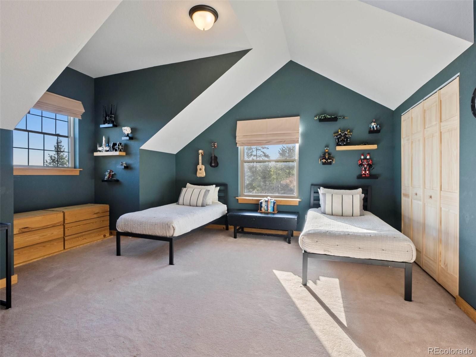 8335 Doubleheader Ranch Road Morrison, CO 80465 - Photo 27 of 40 a living room with furniture and a window