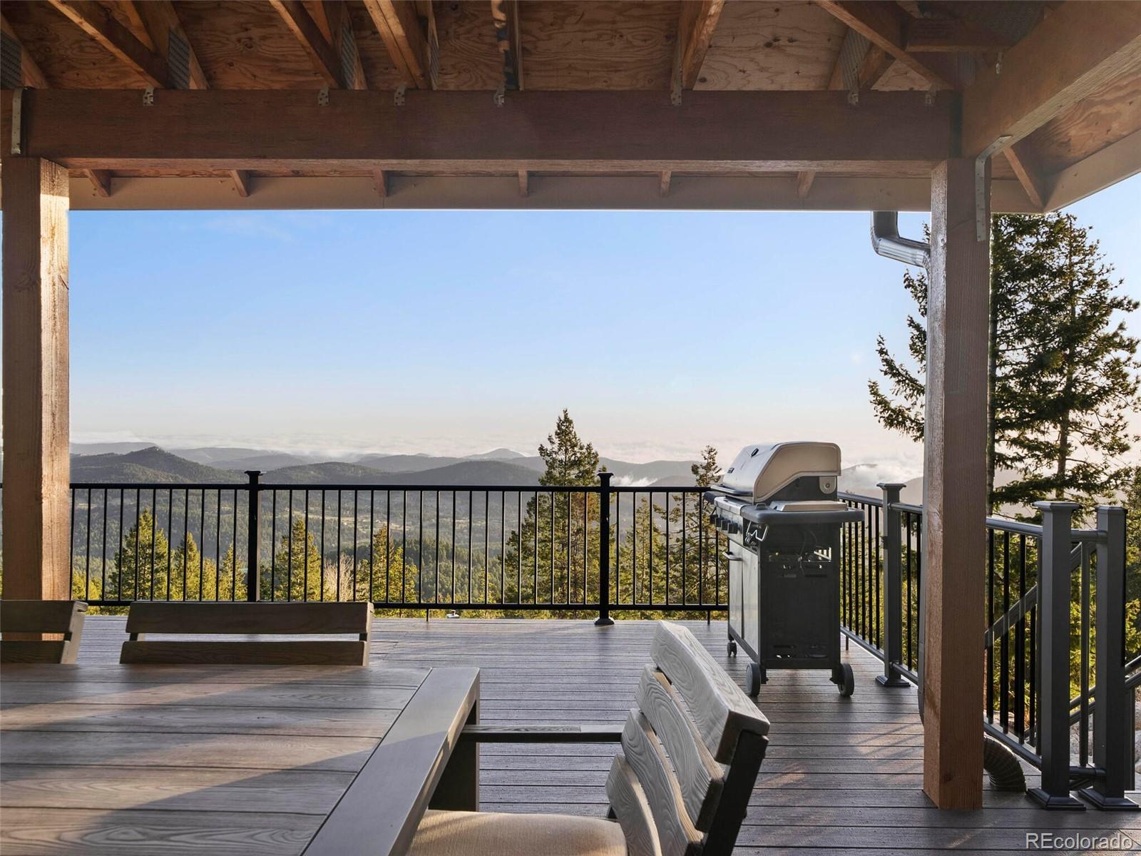 8335 Doubleheader Ranch Road Morrison, CO 80465 - Photo 29 of 40 a view of balcony with wooden floor and seating space