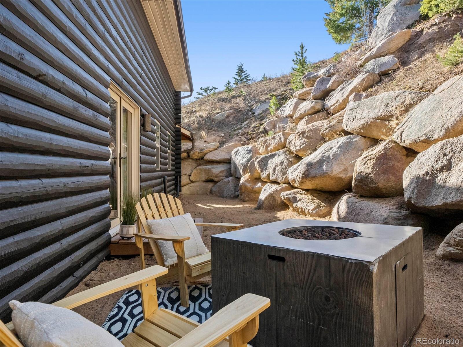 8335 Doubleheader Ranch Road Morrison, CO 80465 - Photo 34 of 40 a view of barbeque area with seating