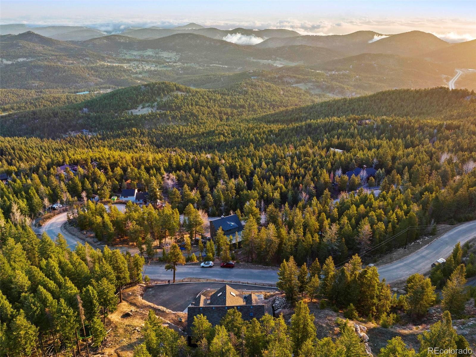 8335 Doubleheader Ranch Road Morrison, CO 80465 - Photo 4 of 40 a view of lake with mountain