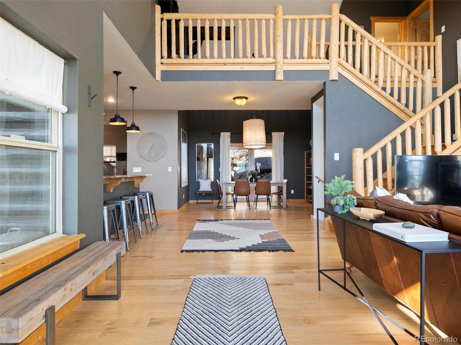 8335 Doubleheader Ranch Road Morrison, CO 80465 - Photo 10 of 40 a view of a living room and dining room