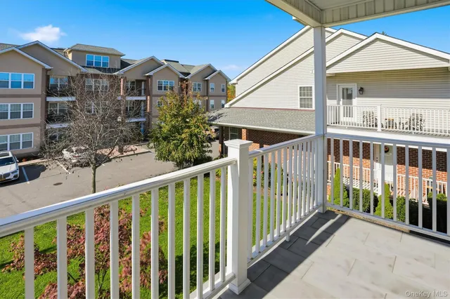 a view of a house with wooden fence