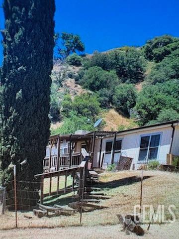 Undisclosed Address Lebec, CA 93243 - Photo 2 of 16 a front view of a house with balcony