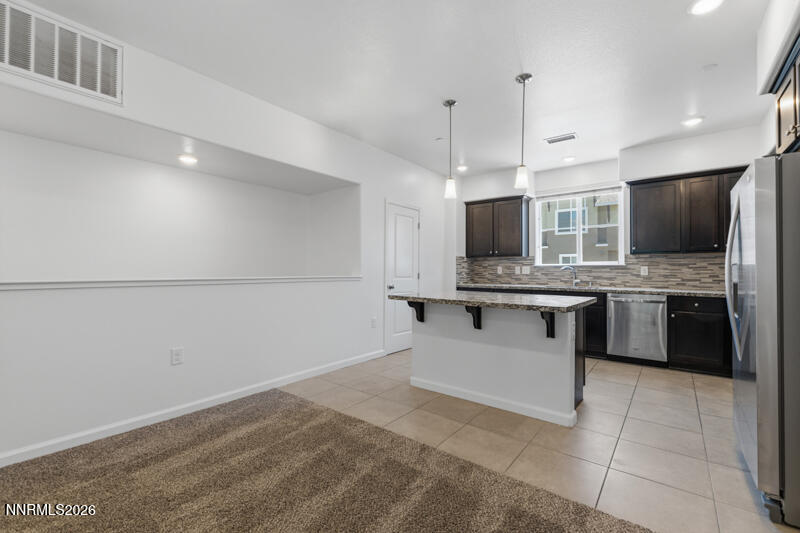 285 Mark Jeffrey Lane Reno, NV 89503 - Photo 2 of 20 a large white kitchen with a stove a sink and a refrigerator