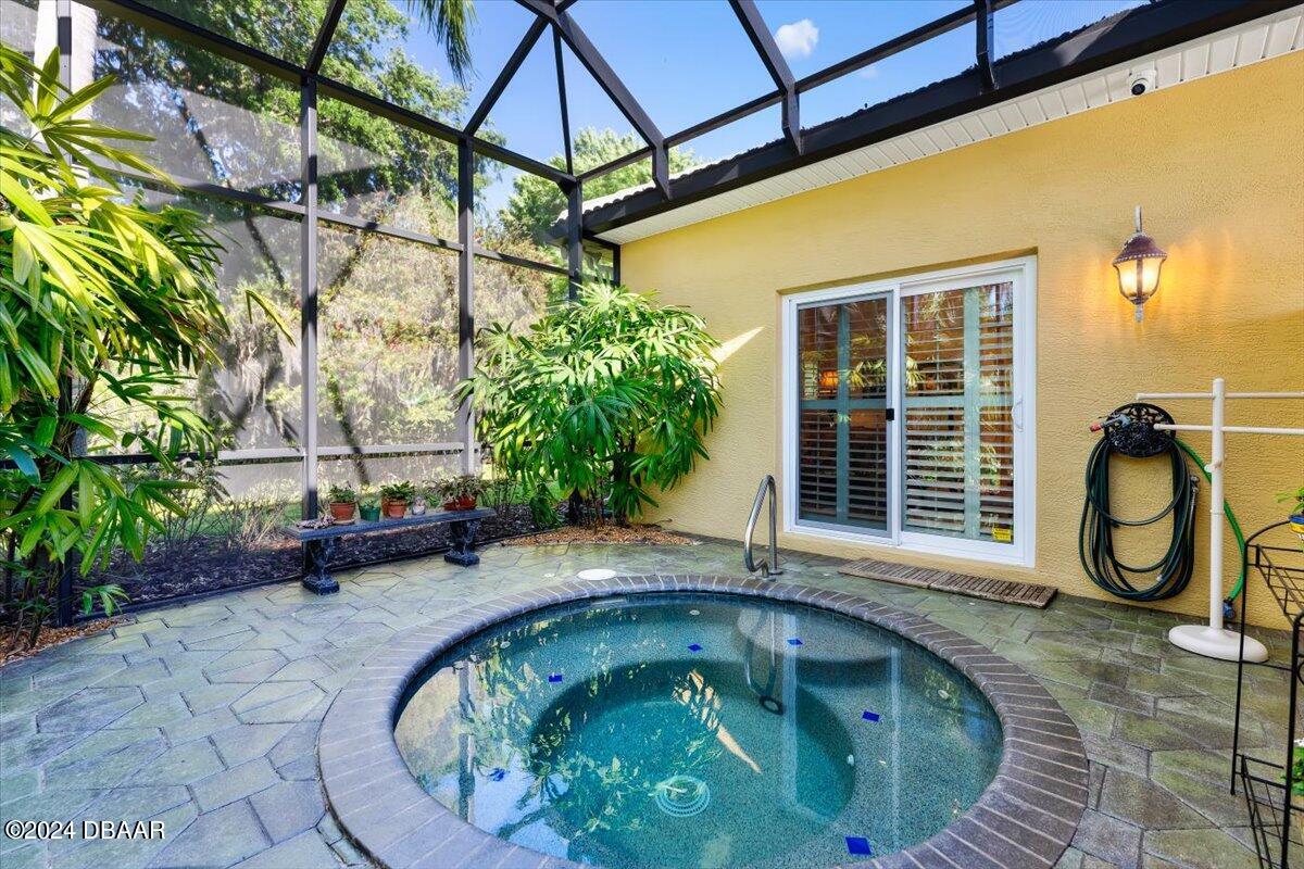 6 Old Canyon Lane Ormond Beach, FL 32174 - Photo 37 of 71 a swimming pool with barbeque oven in front of it