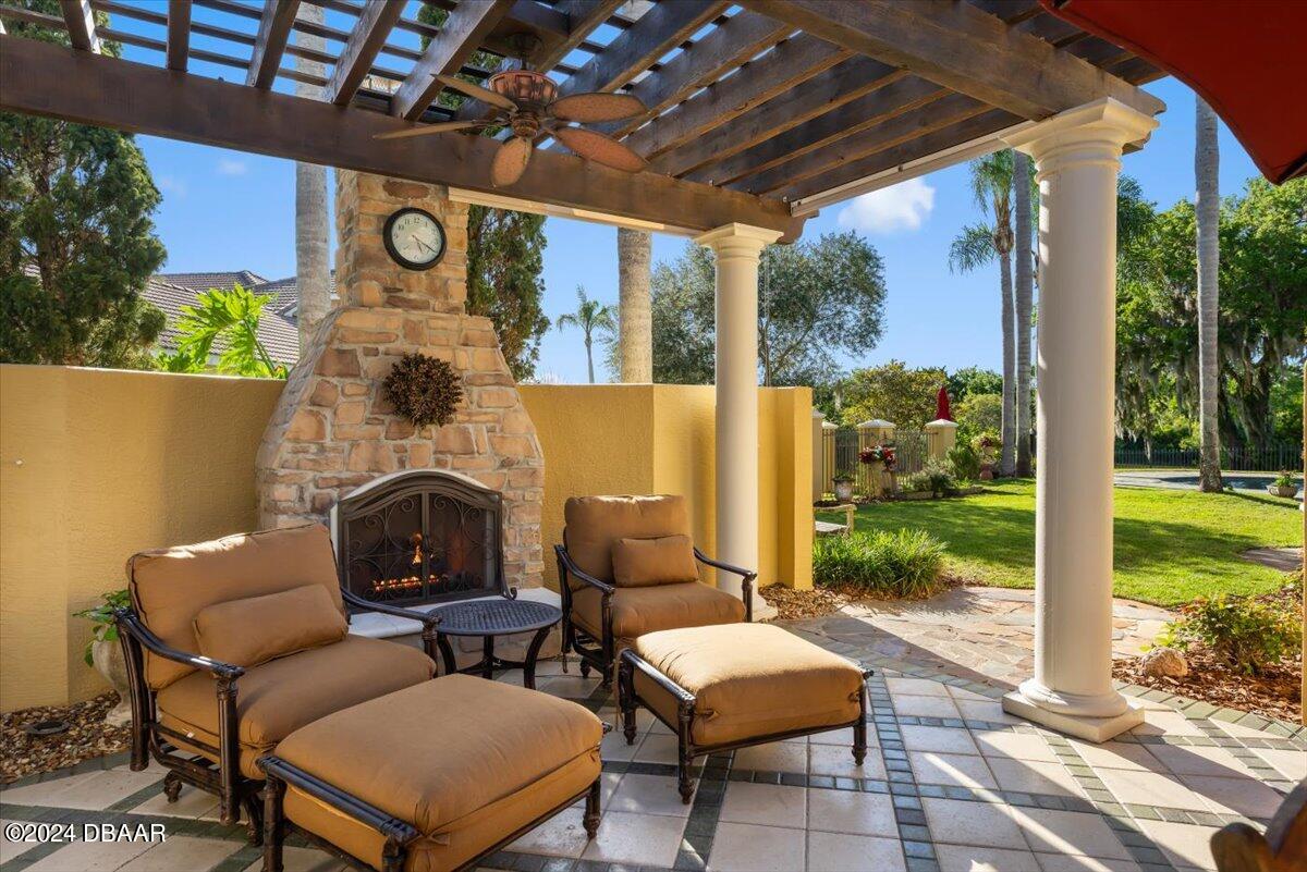 6 Old Canyon Lane Ormond Beach, FL 32174 - Photo 7 of 71 a outdoor space with patio the couches and a dining table with garden view