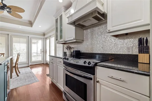 a view of a wooden floor and windows in a room