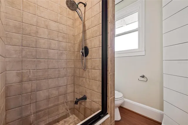 a bathroom with a granite countertop a sink and a mirror