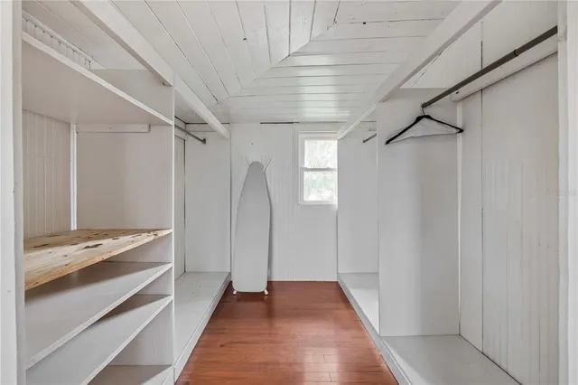 a view of balcony with wooden floor and fence