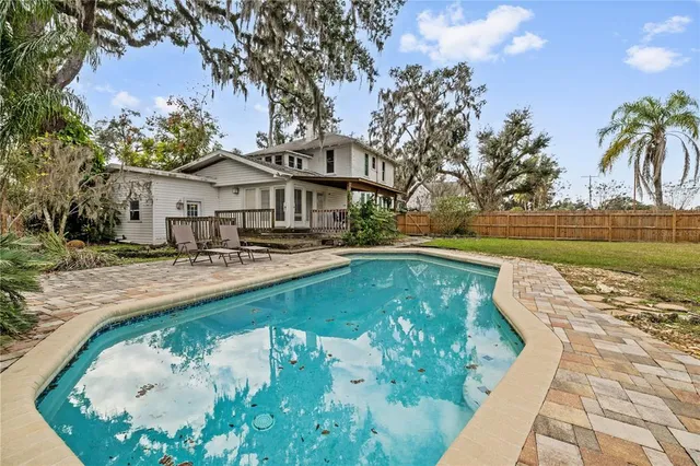 an aerial view of residential houses with yard