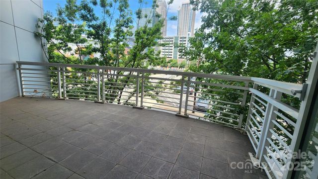 a view of a house with a tree