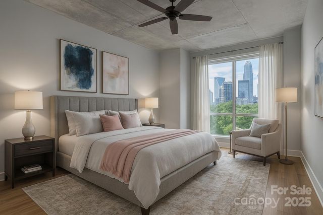 a bedroom with a bed couch and window