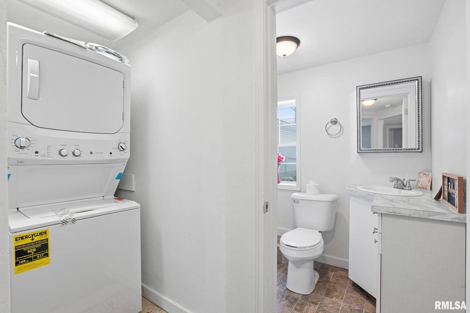 1015 7th Street Colona, IL 61241 - Photo 13 of 19 a bathroom with a toilet sink and mirror