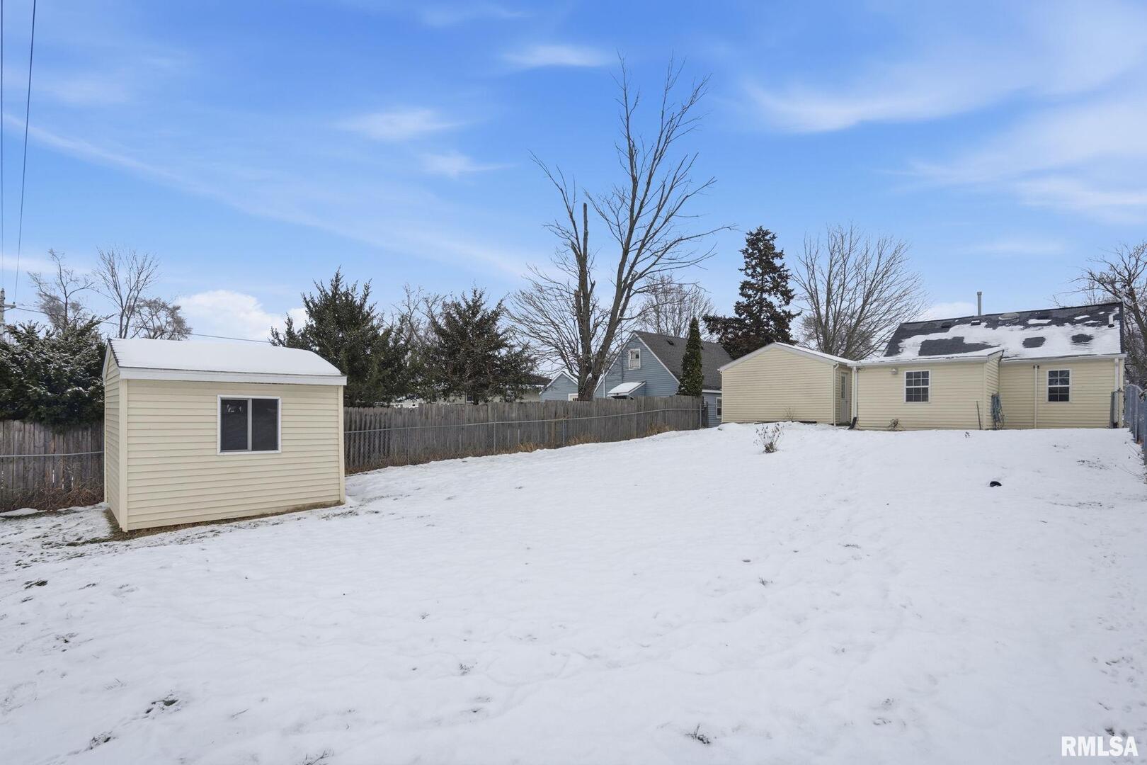 1015 7th Street Colona, IL 61241 - Photo 18 of 19 a view of the house with a yard