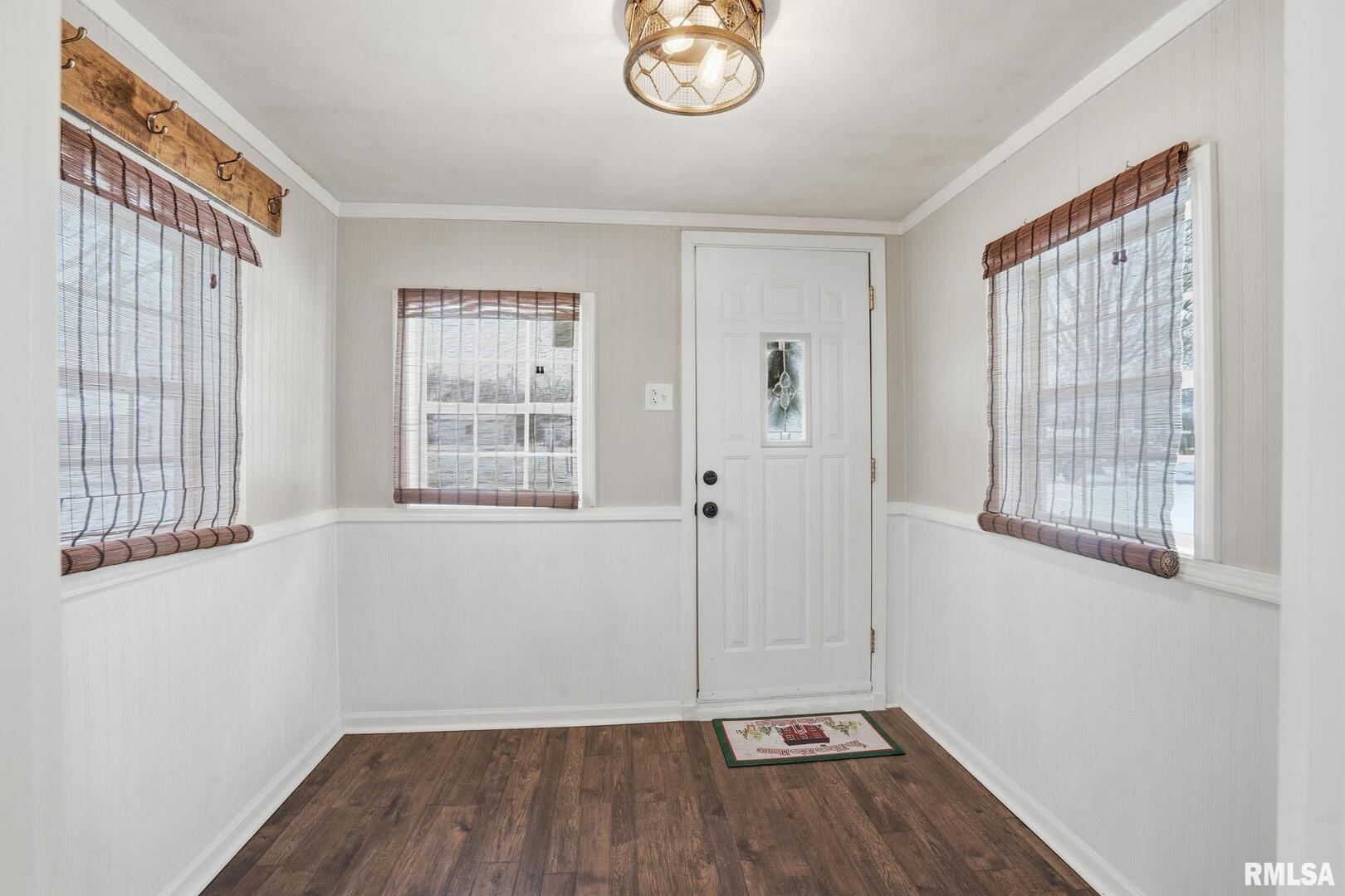 1015 7th Street Colona, IL 61241 - Photo 3 of 19 wooden floor in an empty room with a window