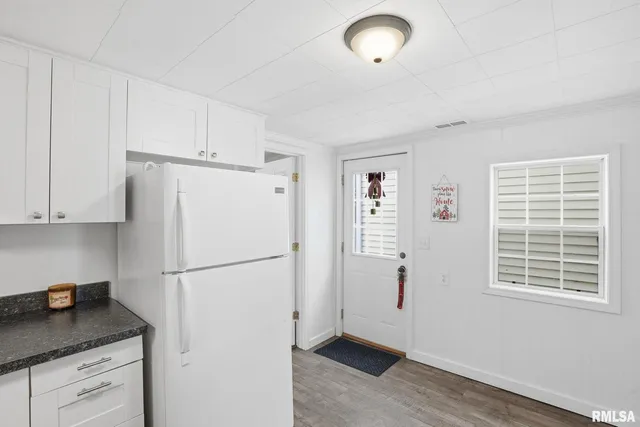 a white refrigerator freezer sitting in a kitchen