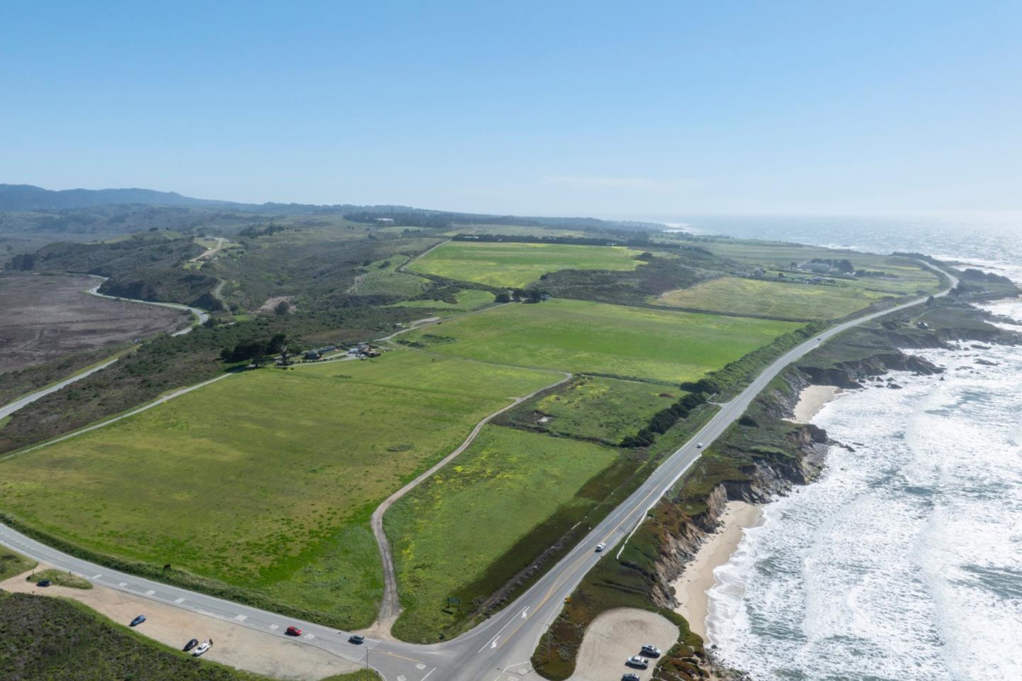 1275 Reservoir Road Pescadero, CA 94060 - Photo 3 of 9 a view of a field with an ocean