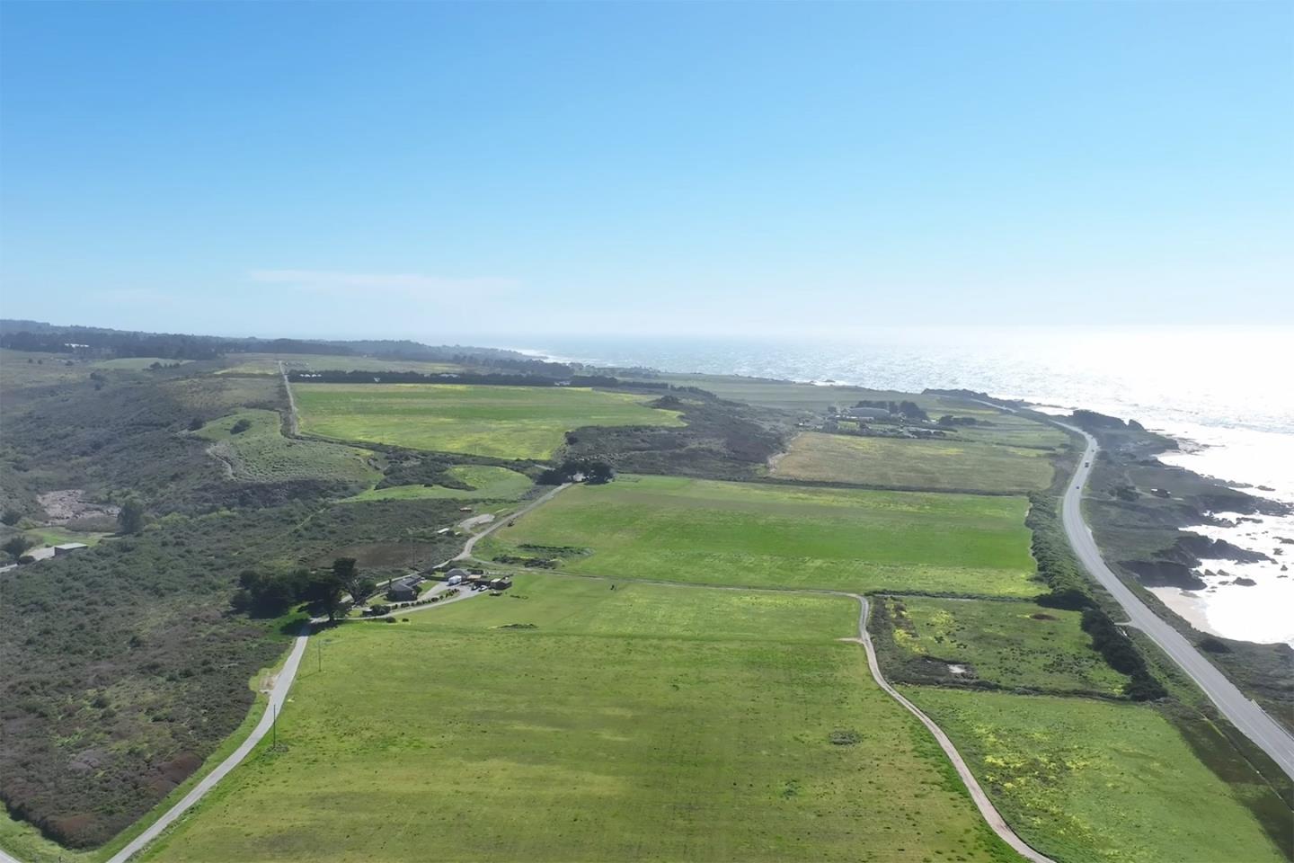 1275 Reservoir Road Pescadero, CA 94060 - Photo 5 of 9 a view of a lake with a yard
