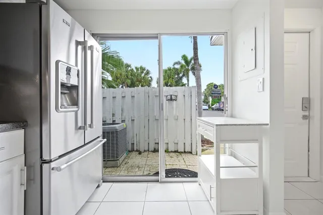 a kitchen with cabinets and appliances