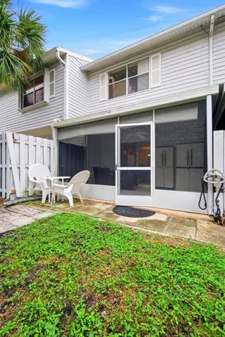 a front view of a house with a yard and a garage