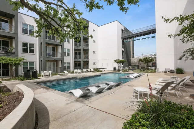 a view of a building with garden and swimming pool