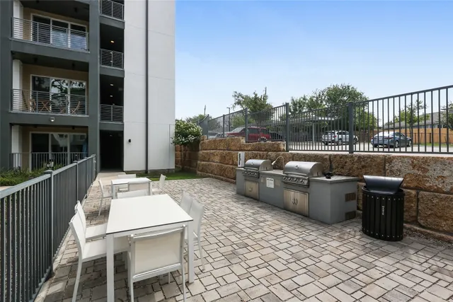 a swimming pool with outdoor seating and yard