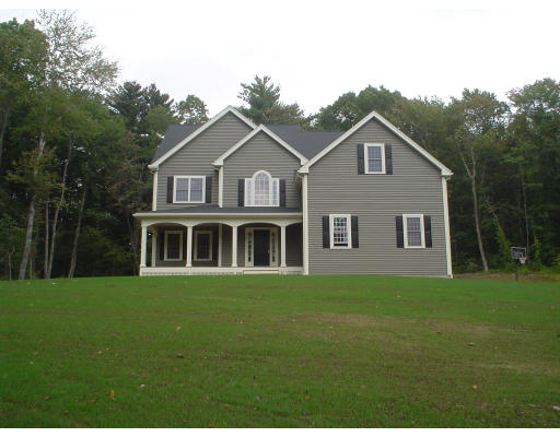 71 Stone School Road Sutton, MA 01590 - Photo 1 of 30 a front view of a house with a garden