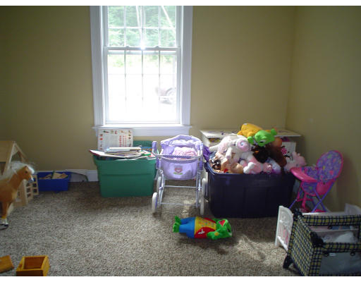 71 Stone School Road Sutton, MA 01590 - Photo 19 of 30 a bedroom with a bed table and a window