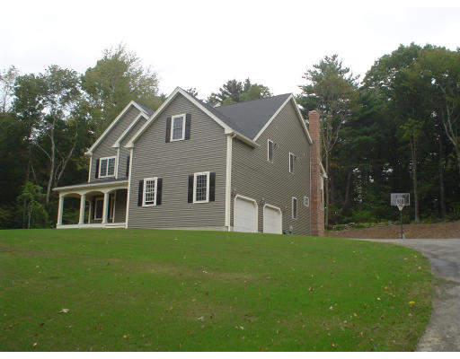 71 Stone School Road Sutton, MA 01590 - Photo 2 of 30 a front view of a house with a garden