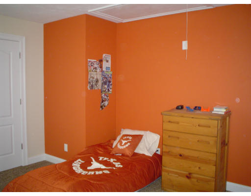 71 Stone School Road Sutton, MA 01590 - Photo 24 of 30 a bedroom with a bed and a cabinet