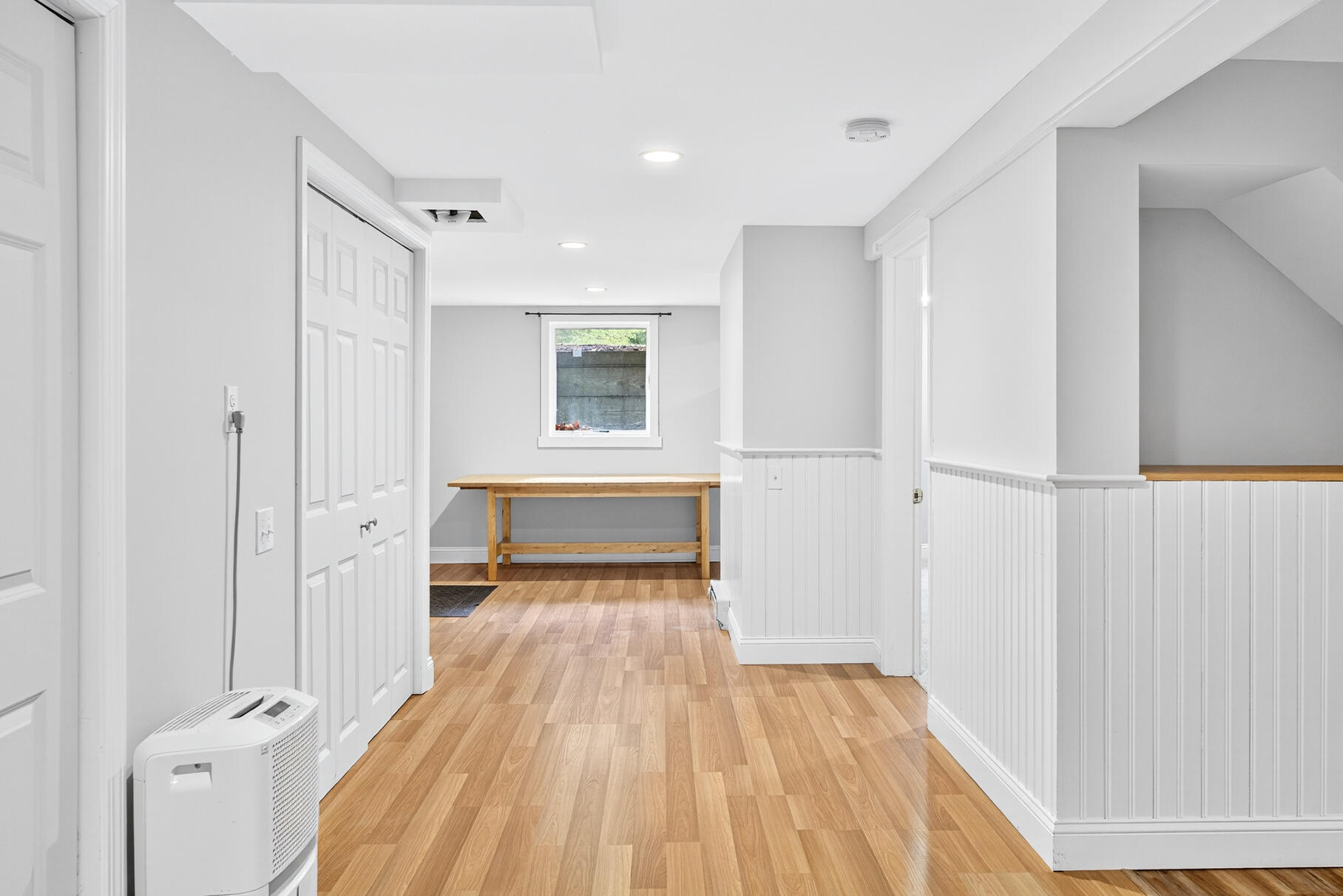 33 Captain William Arthur Road Brewster, MA 02631 - Photo 22 of 40 a view of empty room with wooden floor and fan