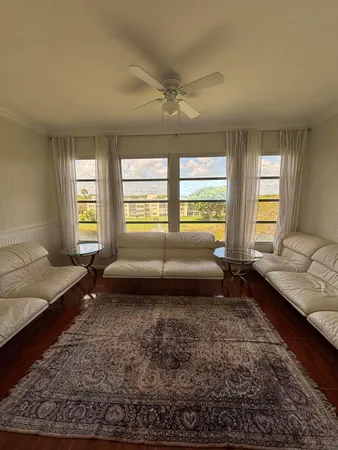 a living room with furniture and a rug