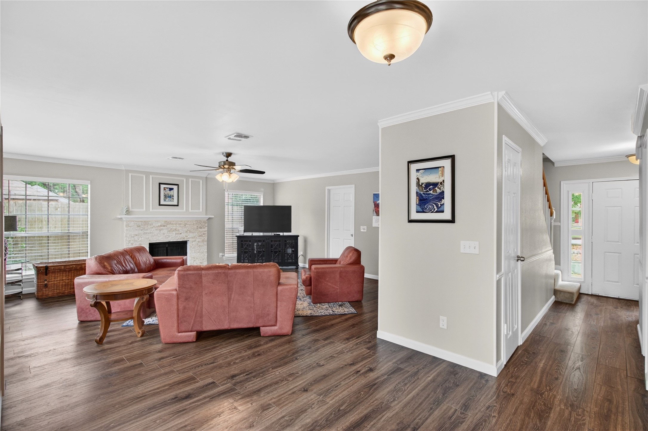 20214 Woodsboro Court Spring, TX 77388 - Photo 17 of 50 Family Room w/Recently Updated Wood-burning Fireplace w/gas connection! Connects to Hallway w/Understair Closet & Powder Half Bath! Recently Painted Interior! Luxury Vinyl Plank throughout 1st Floor!